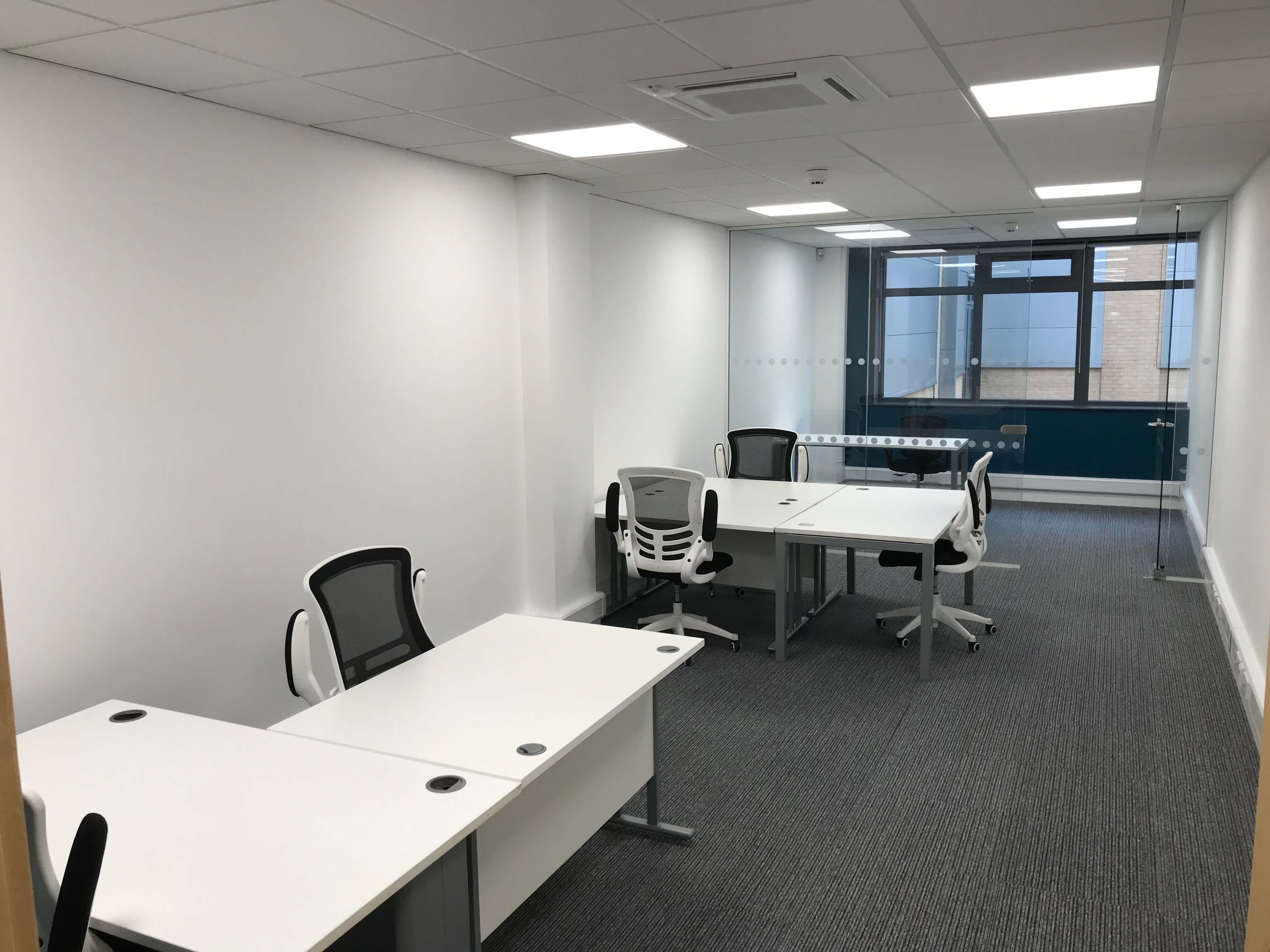 Empty office with desks and office chairs ready to move into