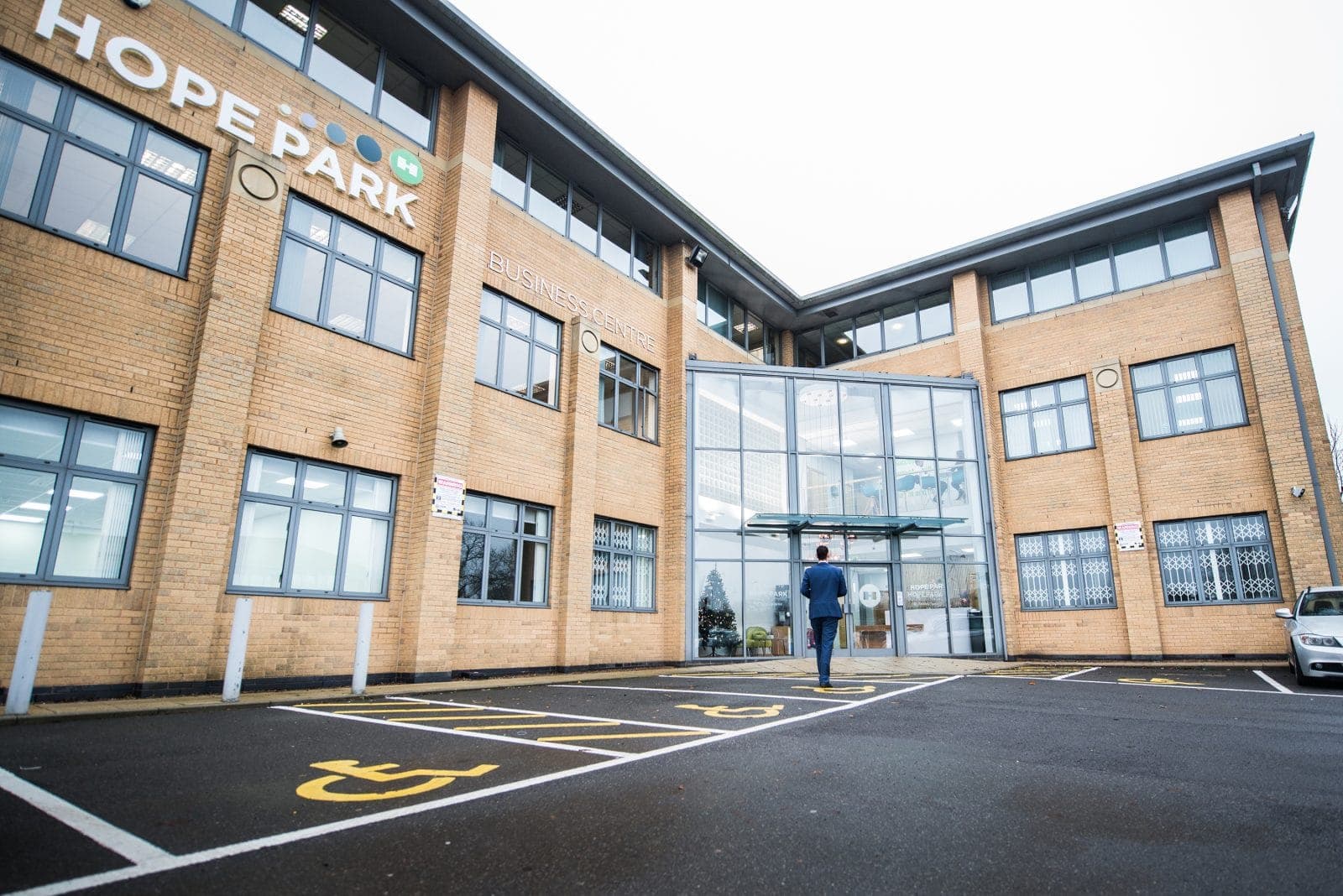 Hope Park Workspaces building with its glass entrance and car park
