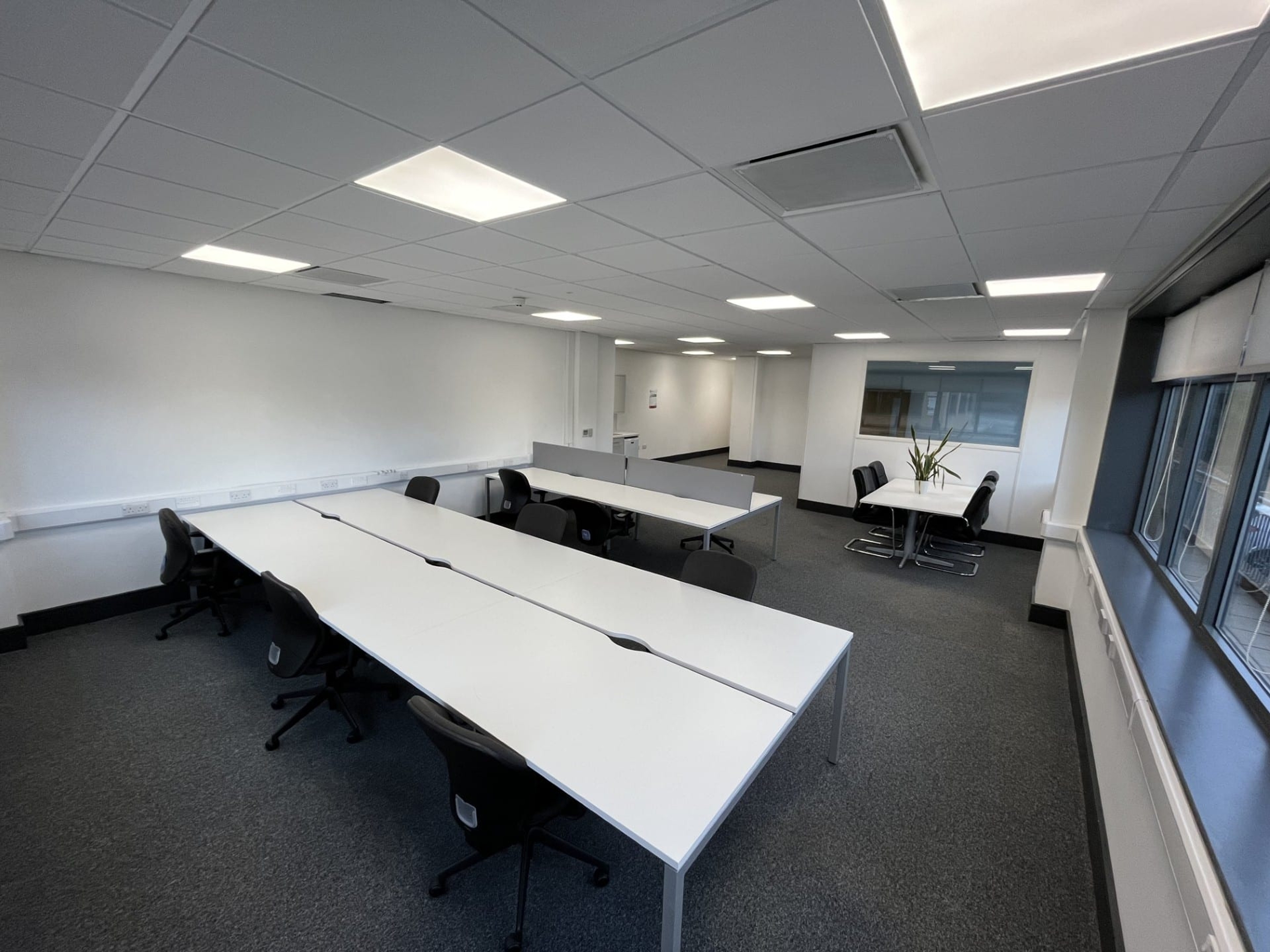 Open-plan office with rows of desks and a meeting table at Hope Park City Gateway, Bradford