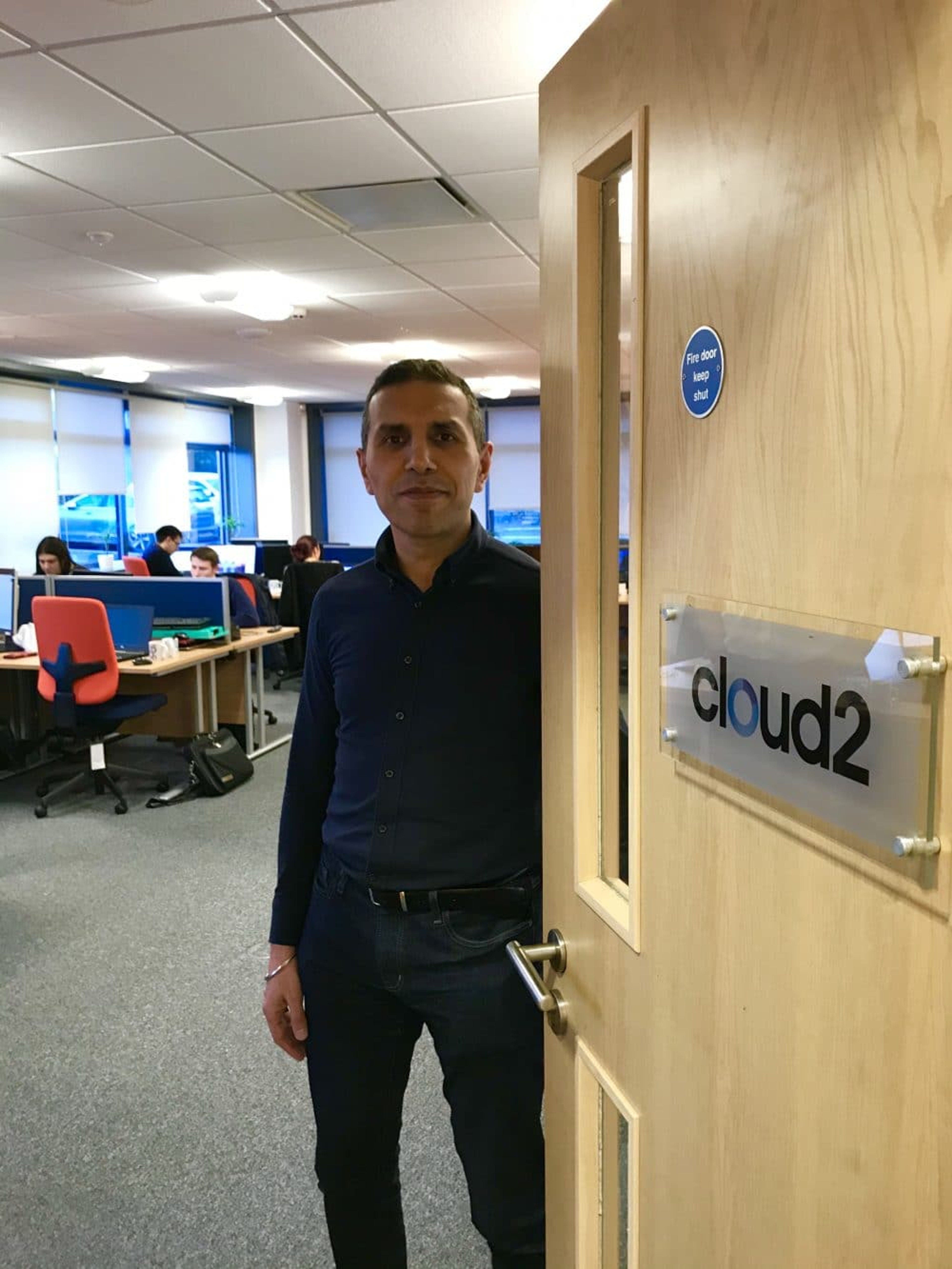Employee Opening Door Into The Office
