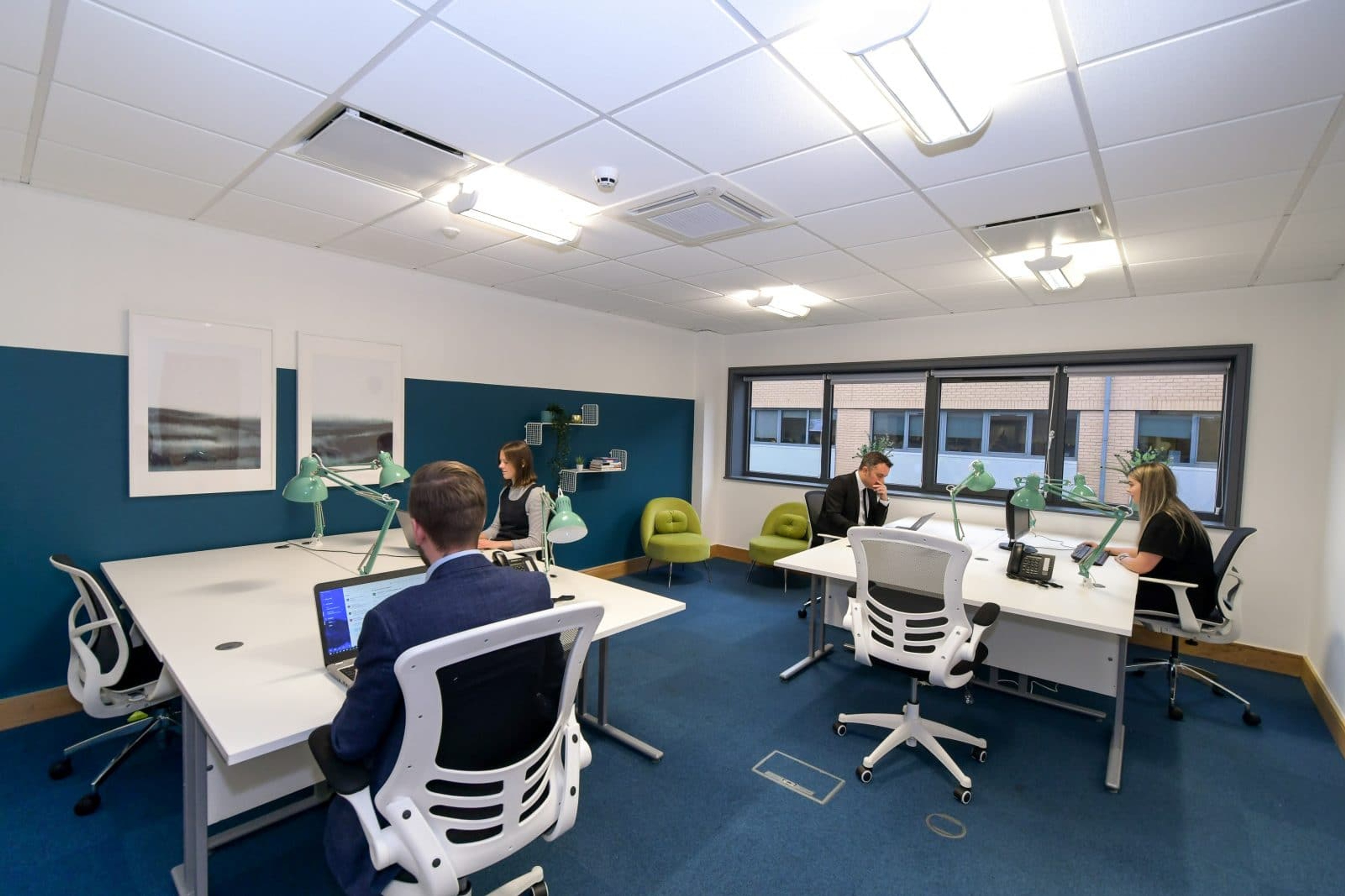 Employees working on laptops in a virtual office in Bradford
